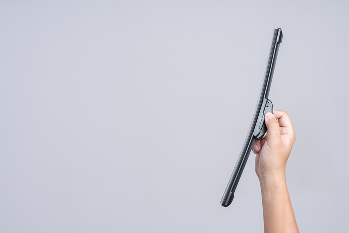 Close-up of wiper blade in hand